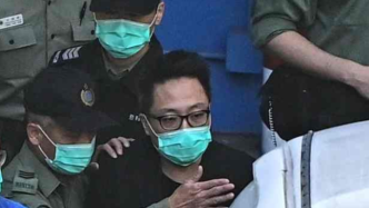 乱港分子谭得志被控14项罪名，保释被拒还押至明年5月候审