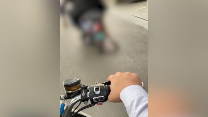 柳州街头男子骑电动车运载尸体，警方：初步排除刑事案件可能