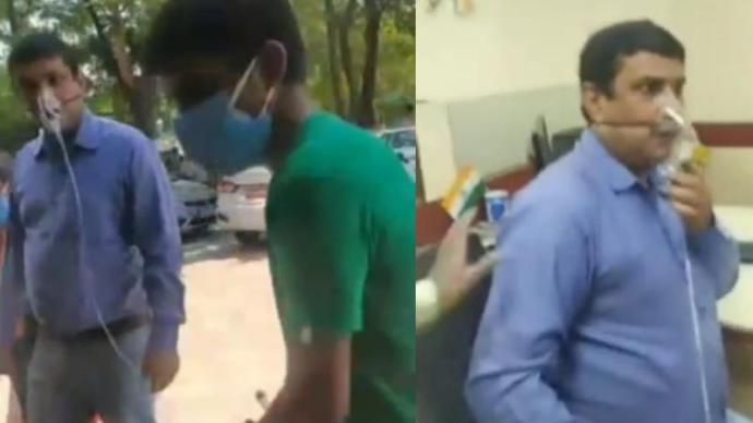 印度一感染新冠男子请假遭拒带氧气瓶上班?公司:自导自演