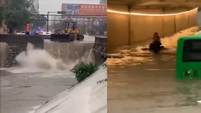 信陽遭遇大暴雨天氣，消防及交警緊急疏通道路救援群眾