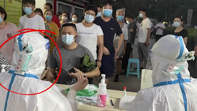 抗疫特写丨郑州医护人员冰棍绑后脑勺降温
