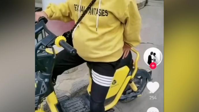 怀孕女子和丈夫乘一辆共享单车被罚，曾拍视频发网络炫耀
