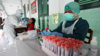 日新增病例达六个月来新高，印尼第三波新冠疫情暴发防控升级