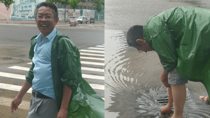 雨后路面积水，河南一大叔在街头徒手清下水道