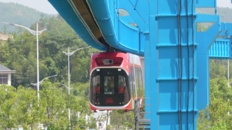 中国首条永磁磁浮轨交工程试验线“红轨”竣工：列车叫兴国号