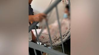 女子剖腹产后，家人用吊篮将她抬上7楼
