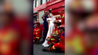 新娘到消防站与未婚夫拍婚纱照：他还要备勤