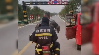 限高杆阻碍消防车通过，“霸气大姐”骑车载消防员奔赴现场
