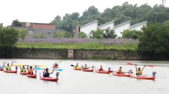杭州十条河道开放水上运动，市民可划皮艇、赛龙舟
