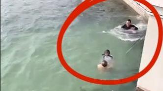 女孩落水，两人接连跳水合力救起