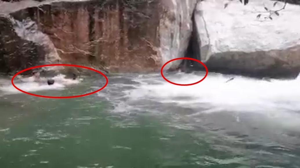 情侣涉水被冲下约3米高瀑布，激流中3名男子将两人救起