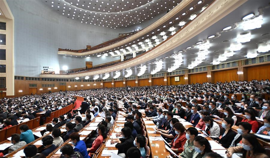 5月21日,中国人民政治协商会议第十三届全国委员会第三次会议在北京人民大会堂开幕。这是委员们在认真听会。