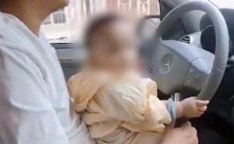 男子怀抱一岁孩子开车朋友圈高调晒娃，被罚