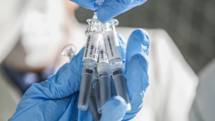 世卫：进入三期临床试验新冠疫苗半数来自中国